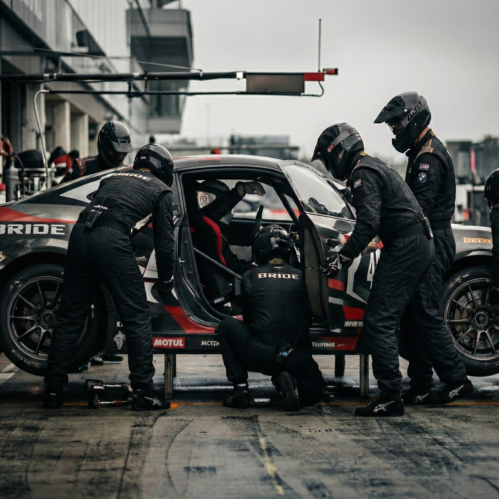 Pit crew working on race car