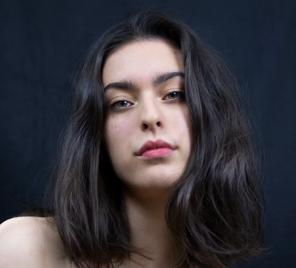 Woman with dark wavy hair